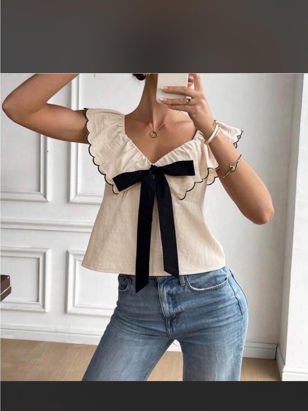 Women’s Cream Ruffle V-Neck Top with Black Bow